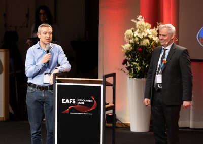Professor Arian van Asten and Dr. Emil Hjalmarsson presenting the winner of Best Student Poster Award during Closing Ceremony. Photo by Marcus Andrae.