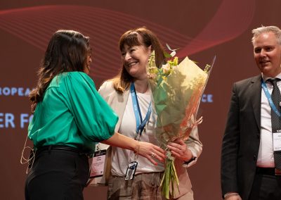 Micaela Rogersten, Conference Administration, EAFS 2022 Organising Committee receives flowers at the Closing Ceremony. Photo by Marcus Andrae.