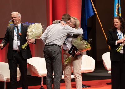 Jonas Malmborg, workshop coordinator, and Maria Holmkvist, conference coordination, receive flowers at Closing Ceremony. Photo by Marcus Andrae.